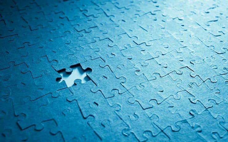 Blue puzzle with one piece missing