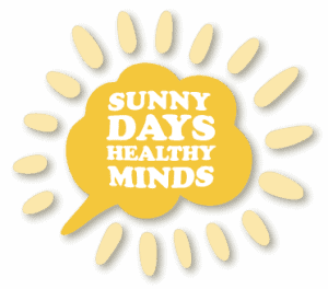 A sunburst design with a central yellow brain shape containing text that reads "Sunny Days, Healthy Minds", surrounded by light yellow rays.