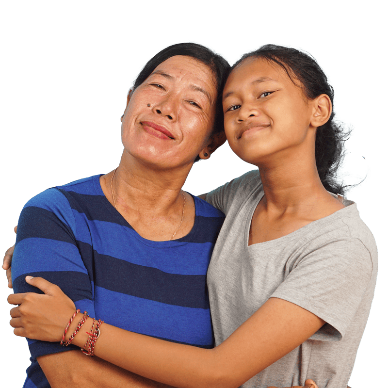 A mother and a daughter smiling and embracing.