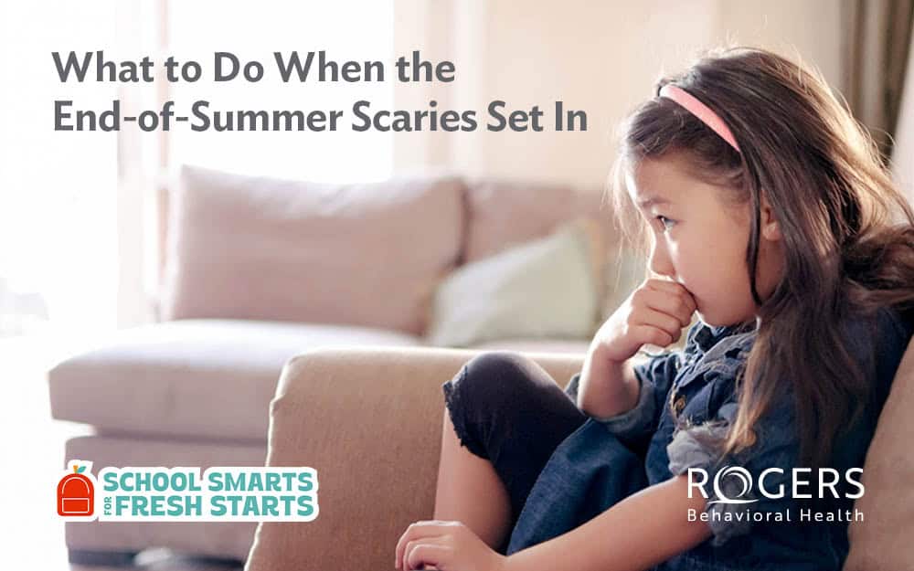 The image shows a young girl sitting on a sofa with her knees up, looking contemplative. She has long brown hair and is wearing a pink headband and a denim jacket. The background features a softly lit room with a beige sofa and pastel-colored pillows. On the left side of the image, there is a block of text in a dark, clear font: What to Do When the End-of-Summer Scaries Set In